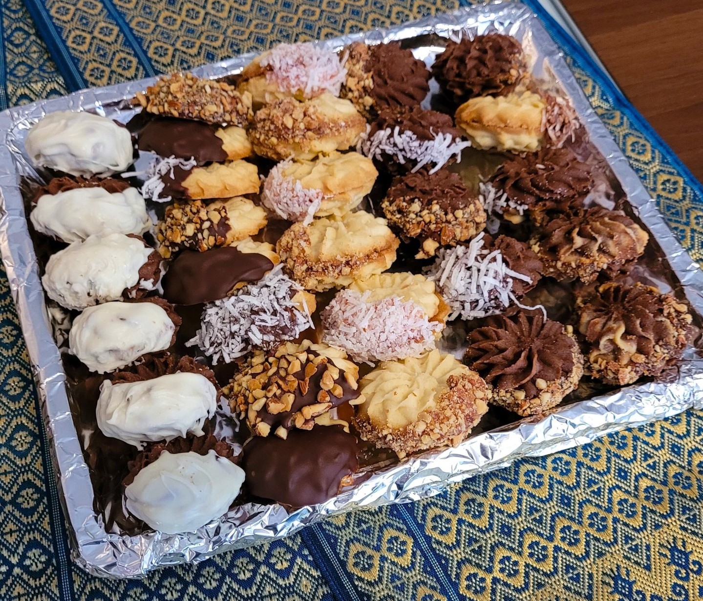 Tray of assorted petit four — chocolate-dipped, coconut-dusted and nut-coated handmade sweets